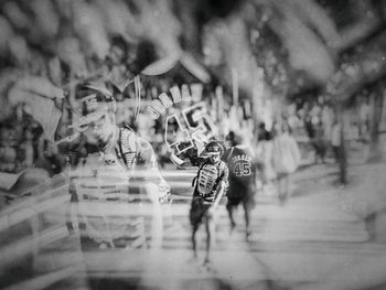 Digital composite image of people at amusement park