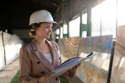 Young woman working at construction site