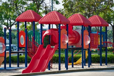 View of playground against trees in park