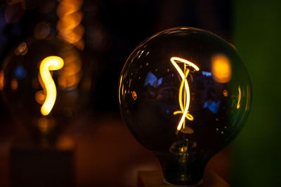 Close-up of illuminated light bulb