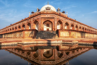 The reflection of humayun's main tomb in new delhi, india. the humayun's tomb complex.