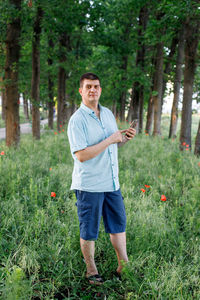 Full length of man standing on field