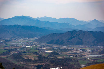 Aerial view of landscape and mountains against sky