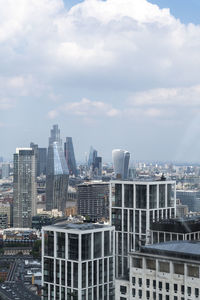 Modern buildings in city against sky