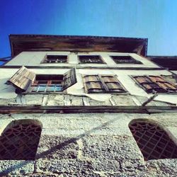 Low angle view of building against blue sky