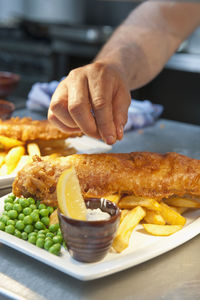 Fish and chips prepared at commercial kitchen in the uk