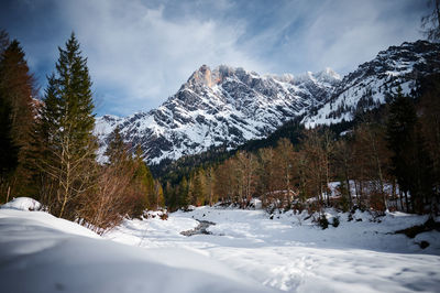 Scenic view of snowcapped mountains against sky