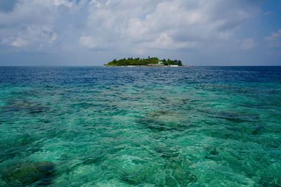 Desert island in maldivian ocean