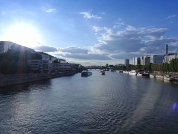 Scenic view of sea against sky in city