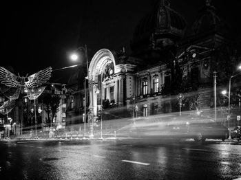 Illuminated city street at night