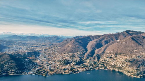 Aerial view of lake and mountains against sky