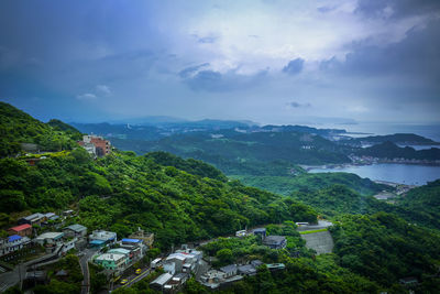 High angle view of trees and mountains against sky