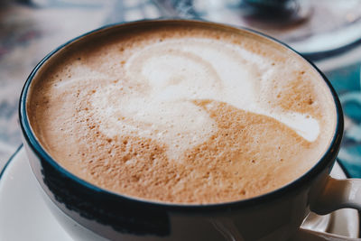 High angle view of cappuccino on table