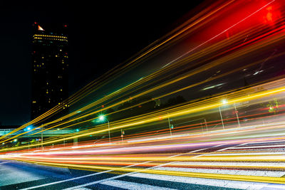 Light trails on road in city at night