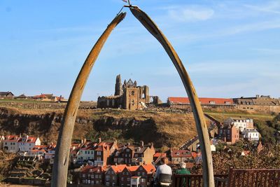 Whitby abbey seen through metallic poles