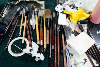 High angle view of paintbrushes on table