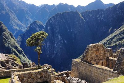 Old ruins against rocky mountains at machu picchu