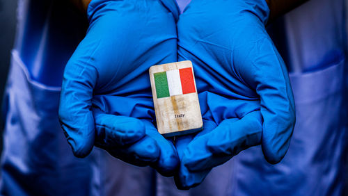 Midsection of man holding ice cream