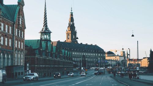 Road along borsen building and christiansborg palace in copenhagen