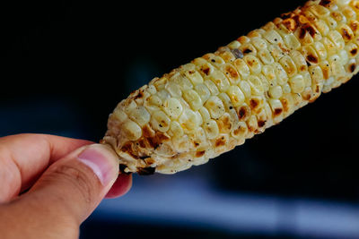 Close-up of hand holding ice cream