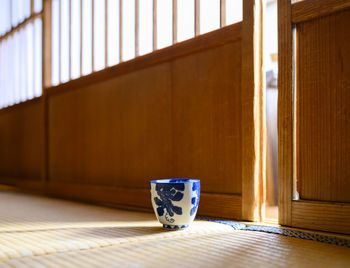 Teacup on the floor of a japanese house.
