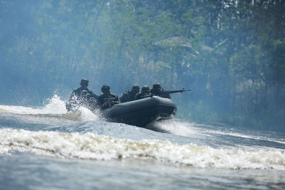 Army soldiers river rafting 