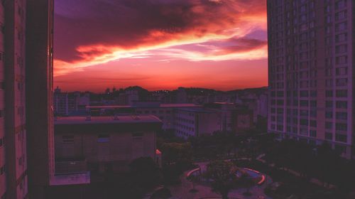 High angle view of buildings against sky during sunset