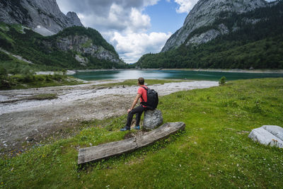 Man on shore against sky