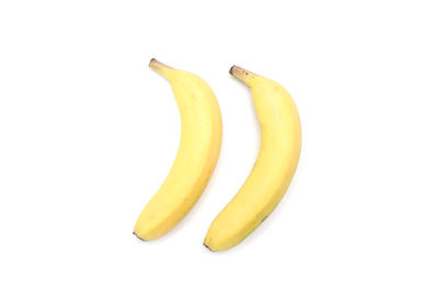 Close-up of bananas against white background