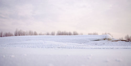 Snow covered river against sky