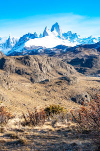 Scenic view of snowcapped mountains against sky