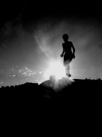 Silhouette of people at sunset