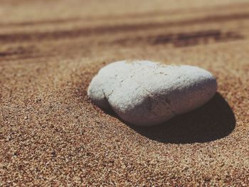 Close-up of pebbles on sand