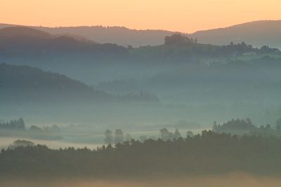 Misty autumn mountain hills landscape. filtered image with cross processed vivid effect.