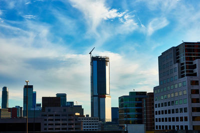 Modern buildings in city against sky