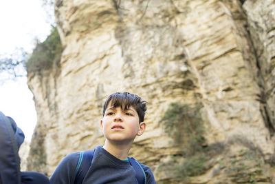 Portrait of a worried young teen outdoors in the mountain