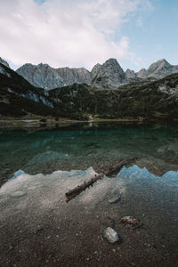 Scenic view of lake and mountains against sky