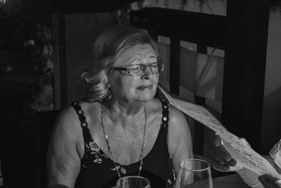 Portrait of woman sitting on floor