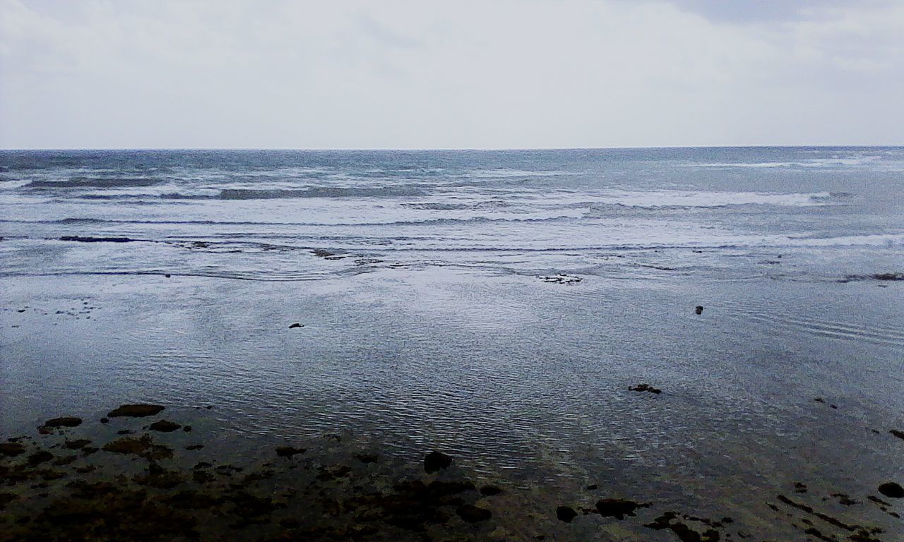 water, sea, horizon over water, beach, tranquil scene, tranquility, scenics, beauty in nature, shore, sky, nature, idyllic, calm, sand, reflection, seascape, coastline, outdoors, remote, rippled