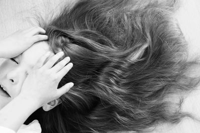 Close-up of woman holding hair