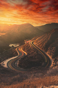 High angle view of vehicles on road at sunset