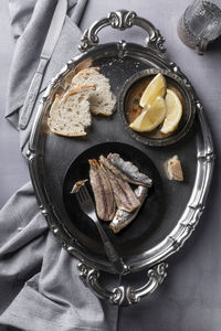 Ready to eat marinated sardines fillets on the table, healthy simple eating concept