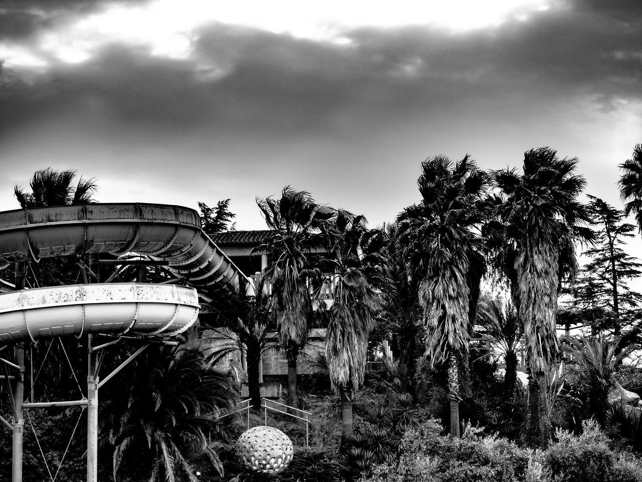 LOW ANGLE VIEW OF AMUSEMENT PARK AGAINST SKY