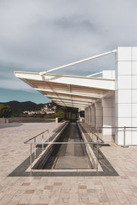 View of airport against cloudy sky