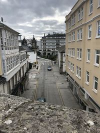 High angle view of buildings in city against sky