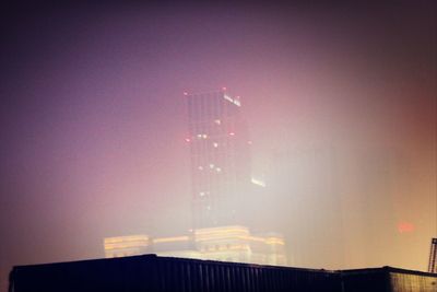 Low angle view of illuminated building at night