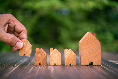 Cropped hand of person holding jigsaw pieces