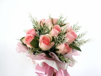 Close-up of rose bouquet against white background