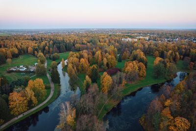 High angle view of river amidst trees against sky