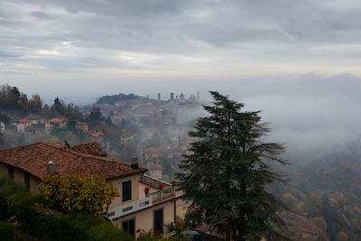 A thick fog enveloped the upper city of bergamo.